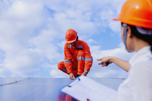 Engineers are checking the solar panel for maintenance. And clean the solar panel is always available.