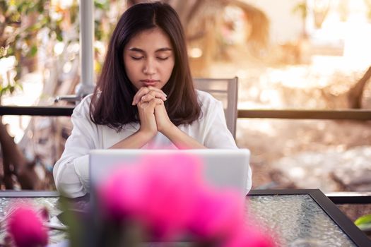 The woman prayed for the morning glow.