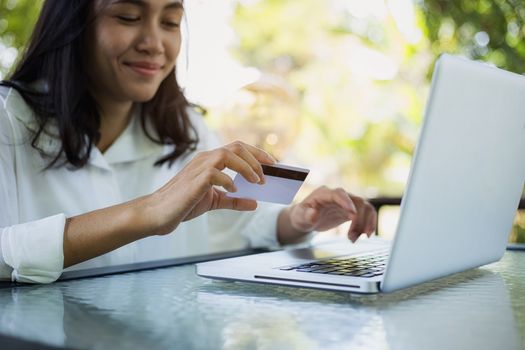 Young woman with credit card payment from shopping online