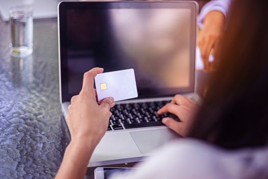 Young woman with credit card payment from shopping online