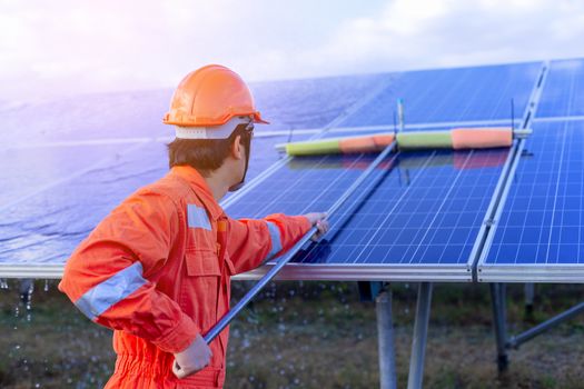 Engineers are checking the solar panel for maintenance. And clean the solar panel is always available.