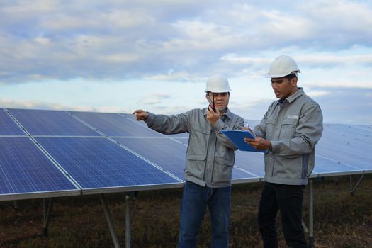 Engineers are checking the solar panel for maintenance. And clean the solar panel is always available.