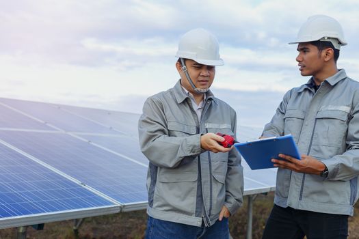 Engineers are checking the solar panel for maintenance. And clean the solar panel is always available.