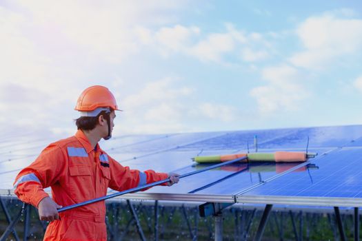 Engineers are checking the solar panel for maintenance. And clean the solar panel is always available.