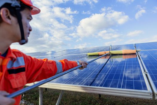 Engineers are checking the solar panel for maintenance. And clean the solar panel is always available.