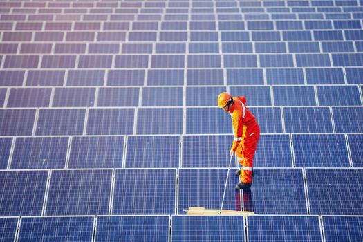 Engineers are checking the solar panel for maintenance. And clean the solar panel is always available.