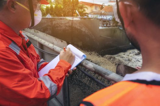 The maintenance technician is inspecting the wastewater treatment equipment of the treatment plant so that it can be operated at all times.