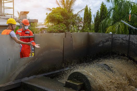 The maintenance technician is inspecting the wastewater treatment equipment of the treatment plant so that it can be operated at all times.