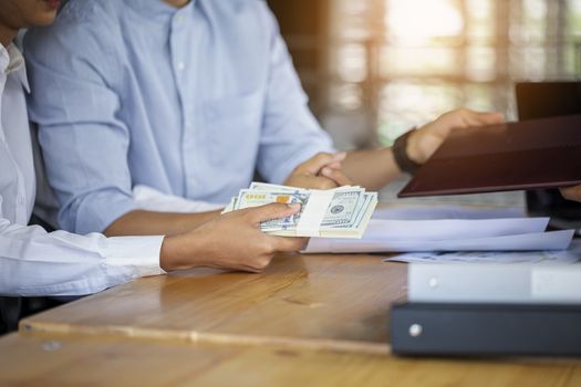 Married family couple happy smiling sign a contract paper document. Smiling couple talking with financial advisor about house loan