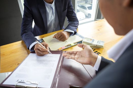 Close up business man signing contract making a deal. Business contract. agreement was signed co-investment business