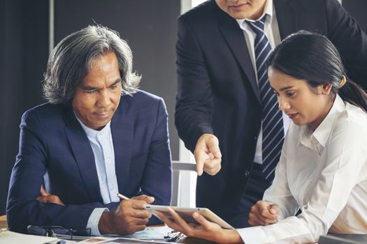 Image of business people hands working with papers at meeting. Businessman holding pens and holding graph paper are meeting to plan sales to meet targets set in next year.