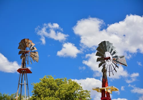 Two windmill on an agricultural farm in Oklahoma, USA.