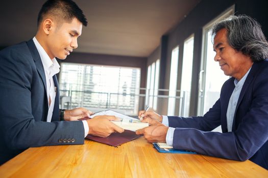 Close up business man signing contract making a deal. Business contract. agreement was signed co-investment business