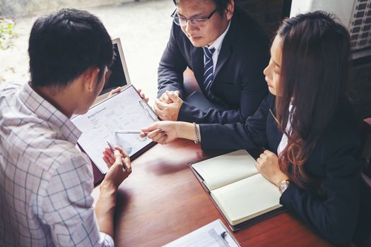 Group of young businessmen are meeting and presenting a plan for successful marketing and business planning.