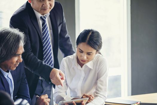 Image of business people hands working with papers at meeting. Businessman holding pens and holding graph paper are meeting to plan sales to meet targets set in next year.