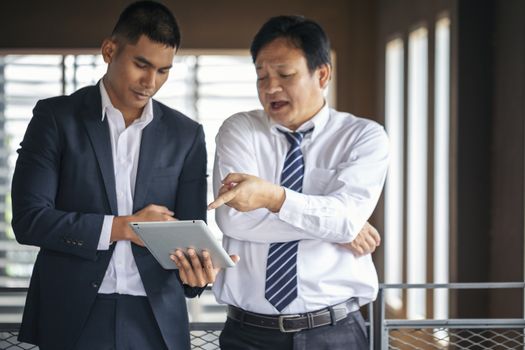 Image of business people hands working with papers at meeting. Businessman holding pens and holding graph paper are meeting to plan sales to meet targets set in next year.