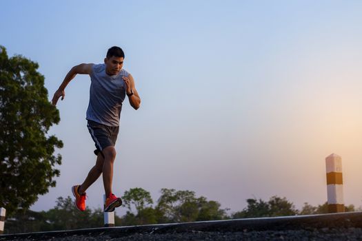 young man runner running on road. healthy lifestyle young fitness man running
