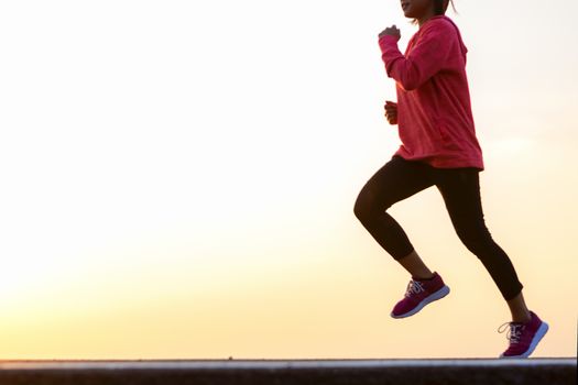 young woman runner running on road. healthy lifestyle young fitness woman running