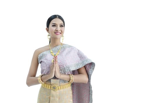 Beautiful Thai women wearing traditional Thai clothes that have a unique Thai culture. Hello, Happy asian woman with blank copyspace, isolated on white background