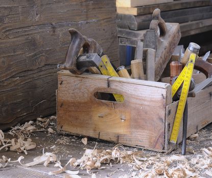 Old toolbox on the workbench in a carpentry