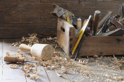 Old toolbox on the workbench in a carpentry