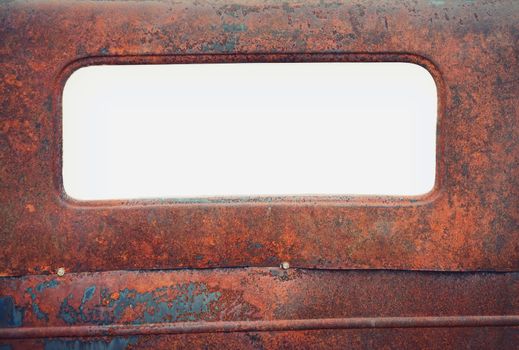 Old rusty car with blank window for copy space.