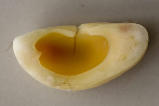 Close up of single piece of Snake fruit. Top view of single healthy fruit. Salak pondoh is one of the salak cultivars that mostly grows in area of Bali. Macro photo of Sweet Salacca zalacca.