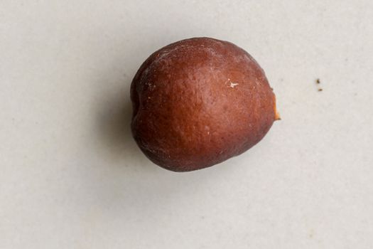 Snake fruit seeds on a white background. Close up of seeds. Salak is a fruit which in Indonesia has almost the same fruit skin as snake skin. The taste of the fruit is delicious.