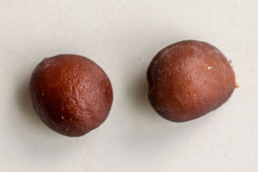 Snake fruit seeds on a white background. Close up of seeds. Salak is a fruit which in Indonesia has almost the same fruit skin as snake skin. The taste of the fruit is delicious.