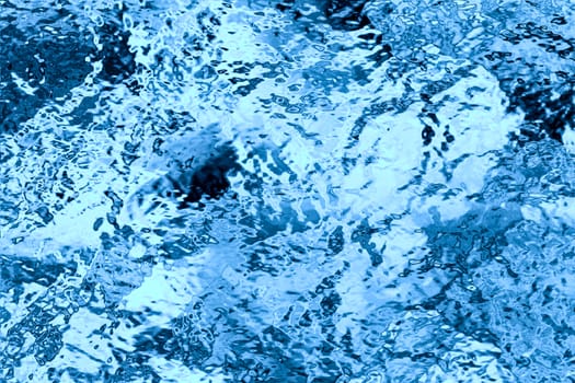 Background or texture of blue water surface.