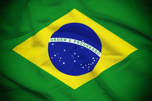 Wavy and rippled national flag of Brazil background.