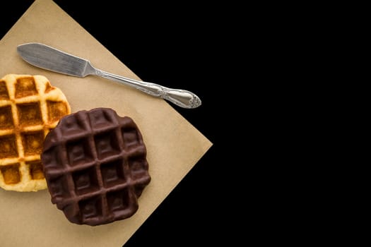 Waffle coated with chocolate as snack for breakfast.