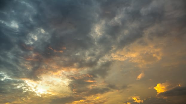 Background of dramatic sky with clouds at sunset or sunrise in HDR.