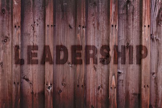 Leadership word engraved on wood expressing leadership concept.