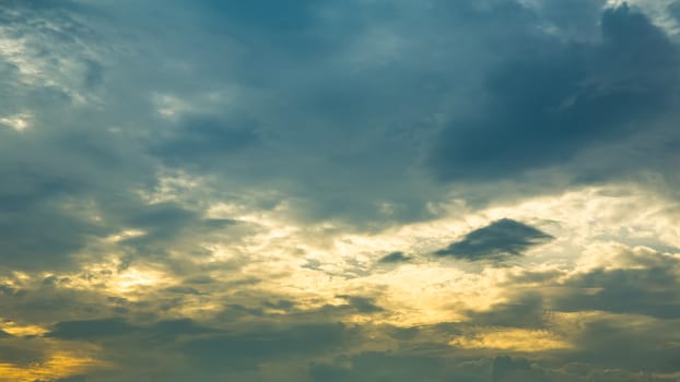 Background of sky with clouds at sunset or sunrise in HDR.