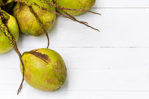 Green fresh coconut with bunch on white background.