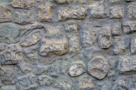 Gray stone texture of old castle wall.