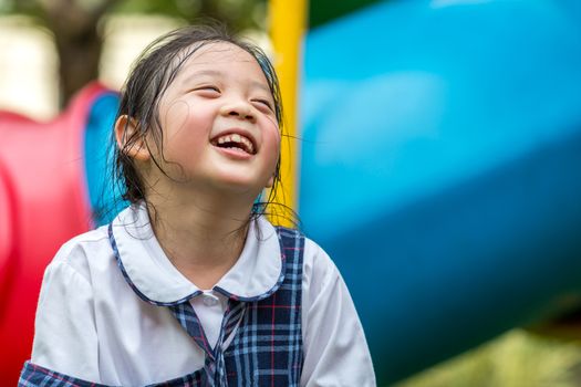 Face expression of super happy child while playing.