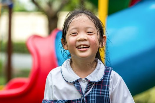 Face expression of child laughing with happiness.