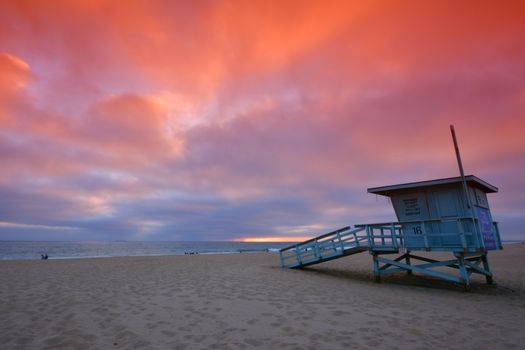 Lifeguard tower with the rosy afterglow of a sunset at Hermosa Beach, California