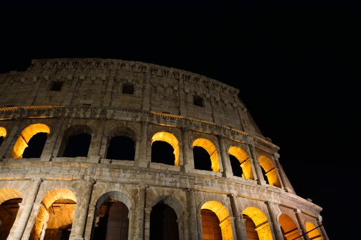 Night view of the Colosseum illuminated in Rome.