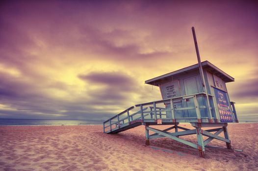 Lifeguard tower with of a sunset at Hermosa Beach, California