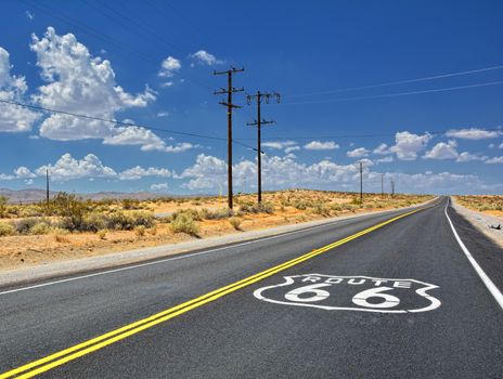 U.S. Route 66 highway, with sign on asphalt on California.