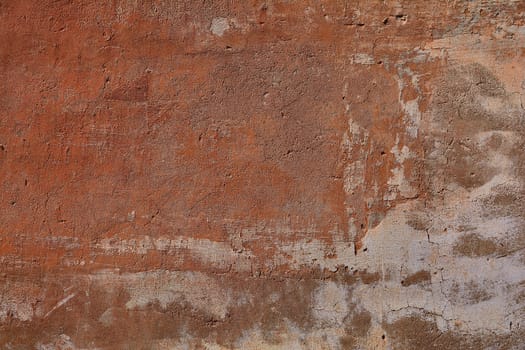Background of stone wall texture. Ocher Old cracked plaster.