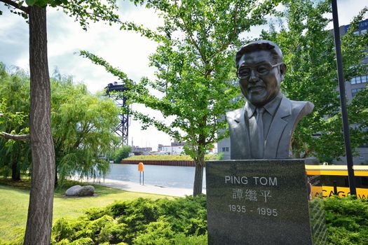 Chicago, IL, July 15, 2017: Ping Tom statue at Ping Tom Memorial Park in Chinatown. Ping Tom, April 15 1935, July 7 1995, was an American businessman and civic leader in Chicago.