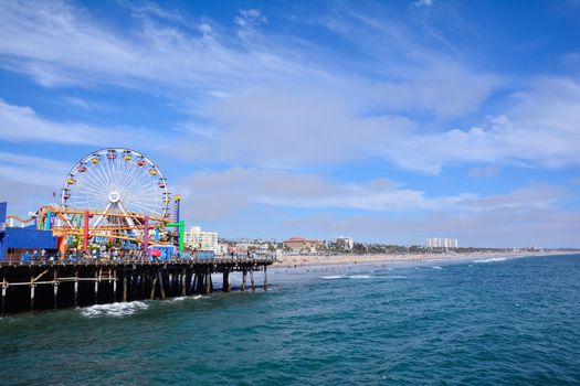 Santa Monica, California - July 27, 2017: Santa Monica Pier in Los Angeles. The pier is a more than hundred-year-old historic landmark that contains Pacific Park, an amusement park.