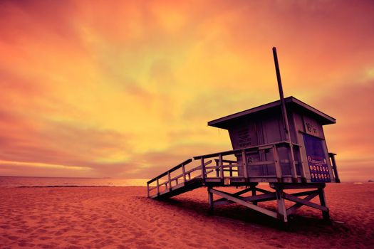 Lifeguard tower with the rosy afterglow of a sunset at Hermosa Beach, California