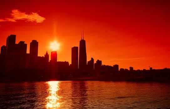 Chicago at sunset skyline across Lake Michigan.