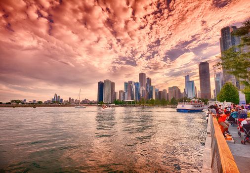 Chicago, Illinois - July 15, 2017: Beautiful Chicago Skyline. Cityscape image of Chicago skyline during sunset. People enjoying a summer day on the shore of Lake Michigan