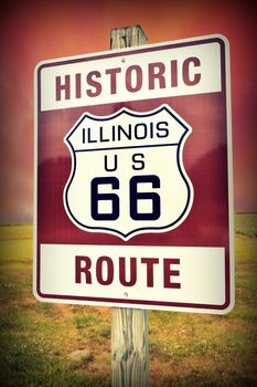 Historic Illinois Route 66 vintage sign with sunset.